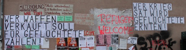 picture showing protest banners at the refugee camp in the former airport on Tempelhofer Feld